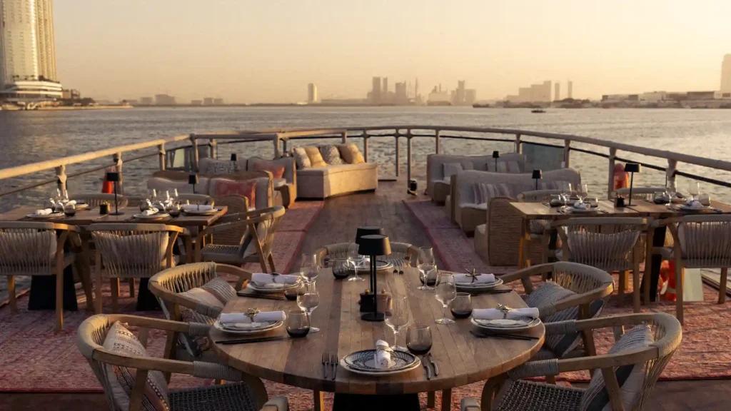 The deck of the Lady Nara dhow, laid for dinner at sunset