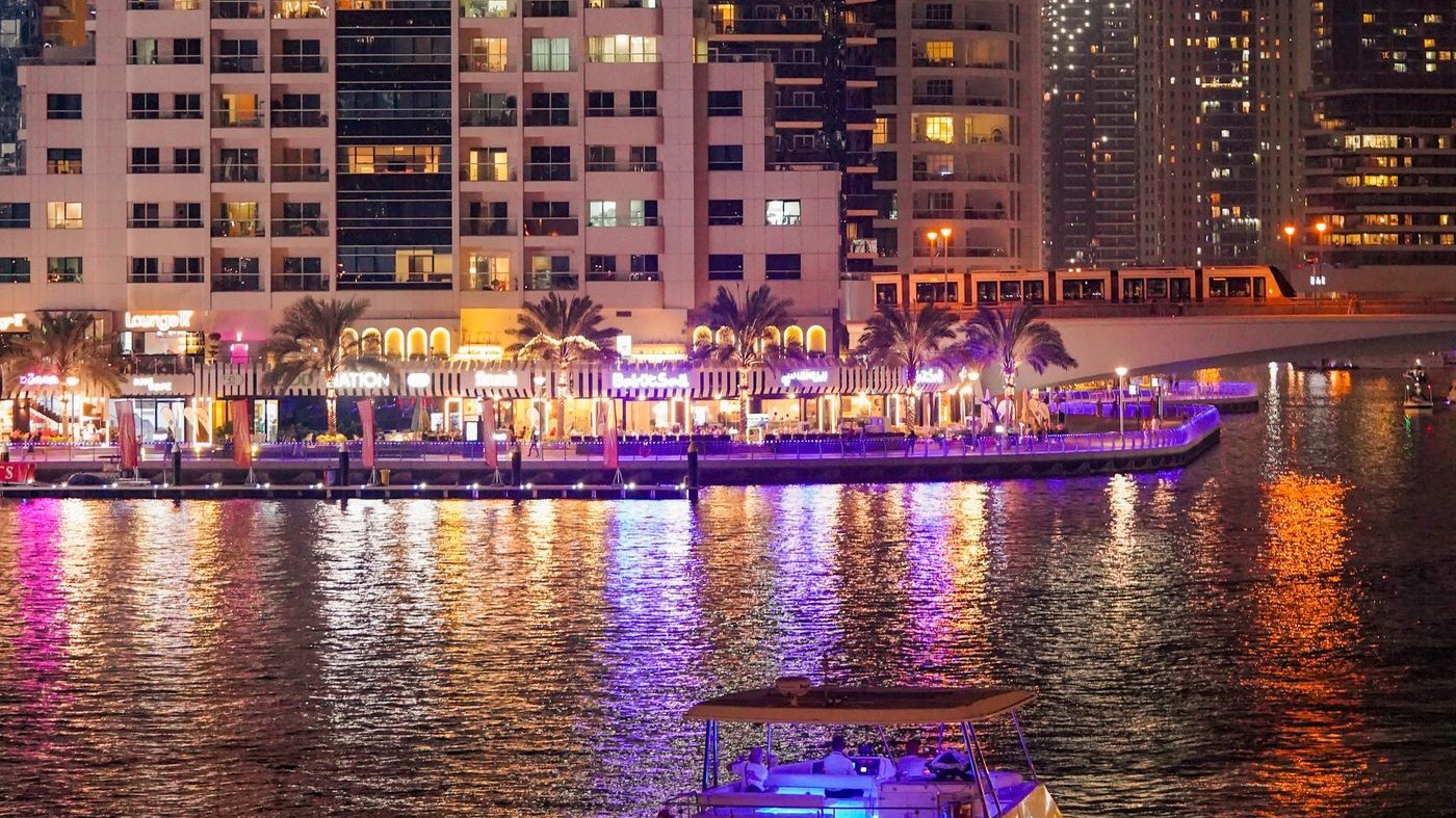 Lotus megayacht on Dubai Marina at night